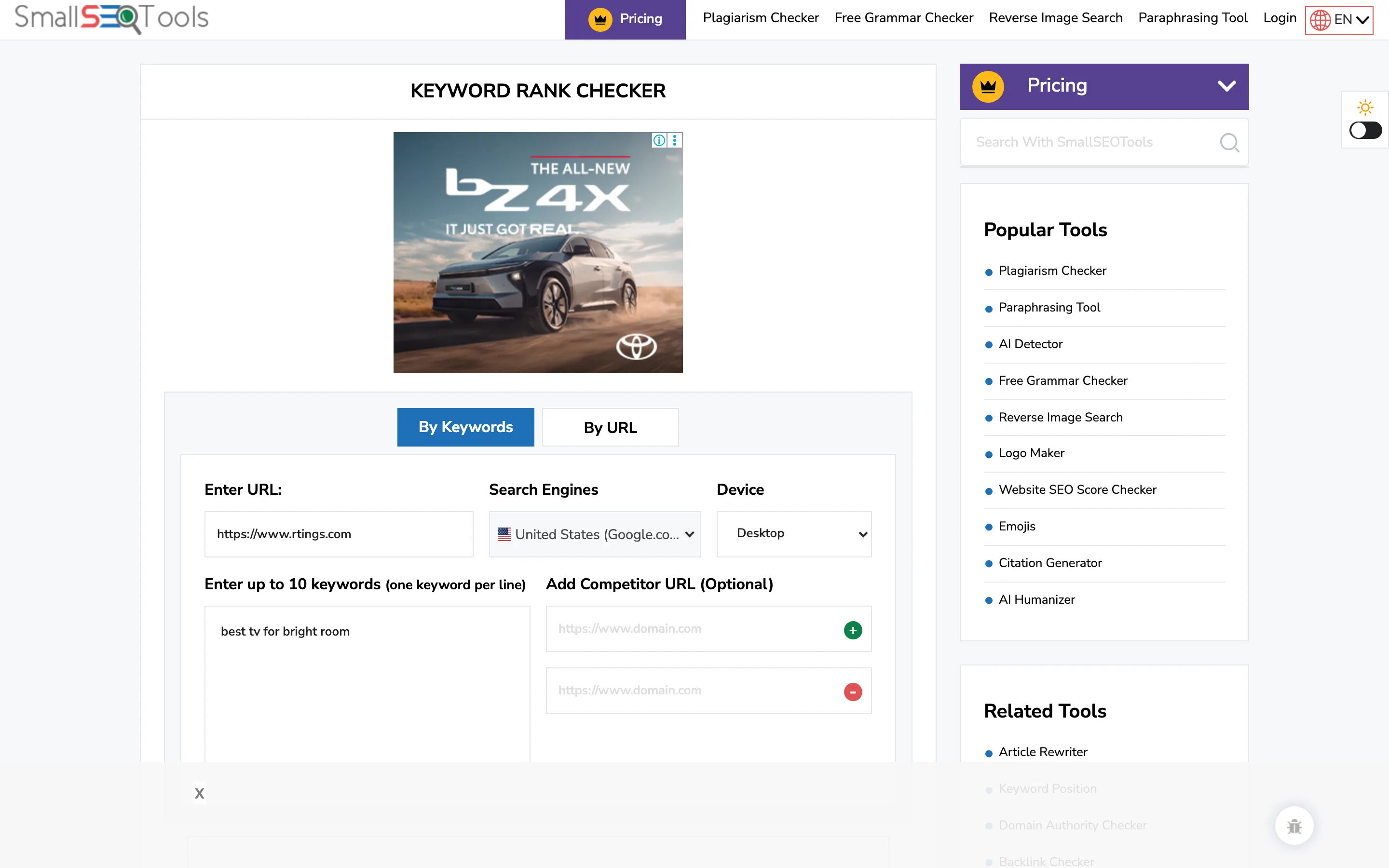 The SmallSEOTools Keyword Position tool, showing a URL field containing "https://www.rtings.com", a keywords box containing "best tv for bright room", and two optional competitor domain fields.