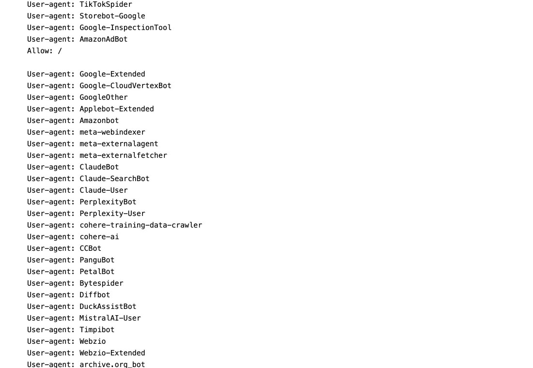 An excerpt of wired.com's robots.txt file listing blocked user agents including Google-Extended, Applebot-Extended, Amazonbot, meta-externalagent, ClaudeBot, Claude-SearchBot, Claude-User, PerplexityBot, cohere-ai, CCBot, Bytespider, Diffbot, DuckAssistBot, MistralAI-User and Timpibot.